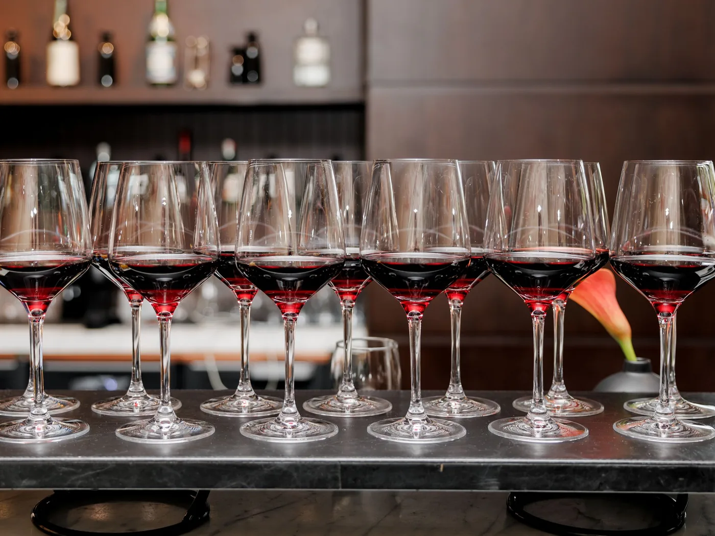 A flight of Chianti wines poured on a barrel table with olive oil and bread